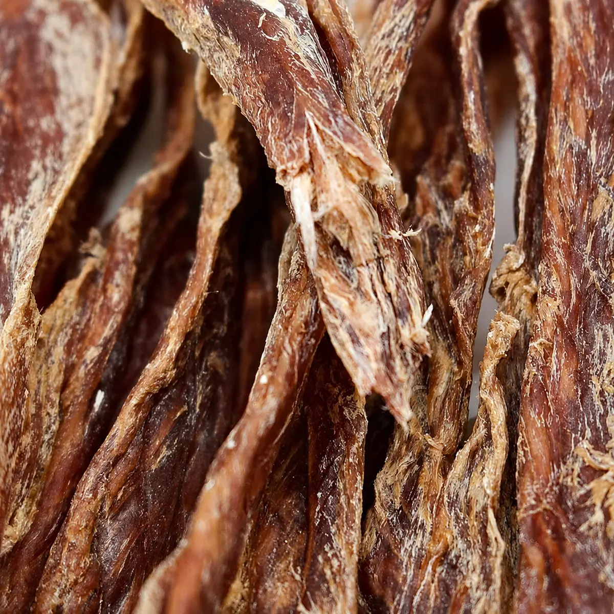 Close-up of dried duck breast texture showing meat fiber — view 2